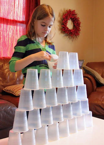 kids busy in STACKING WASTE CUPS
