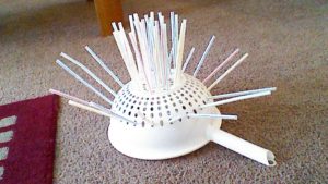STRAWS THROUGH COLANDER